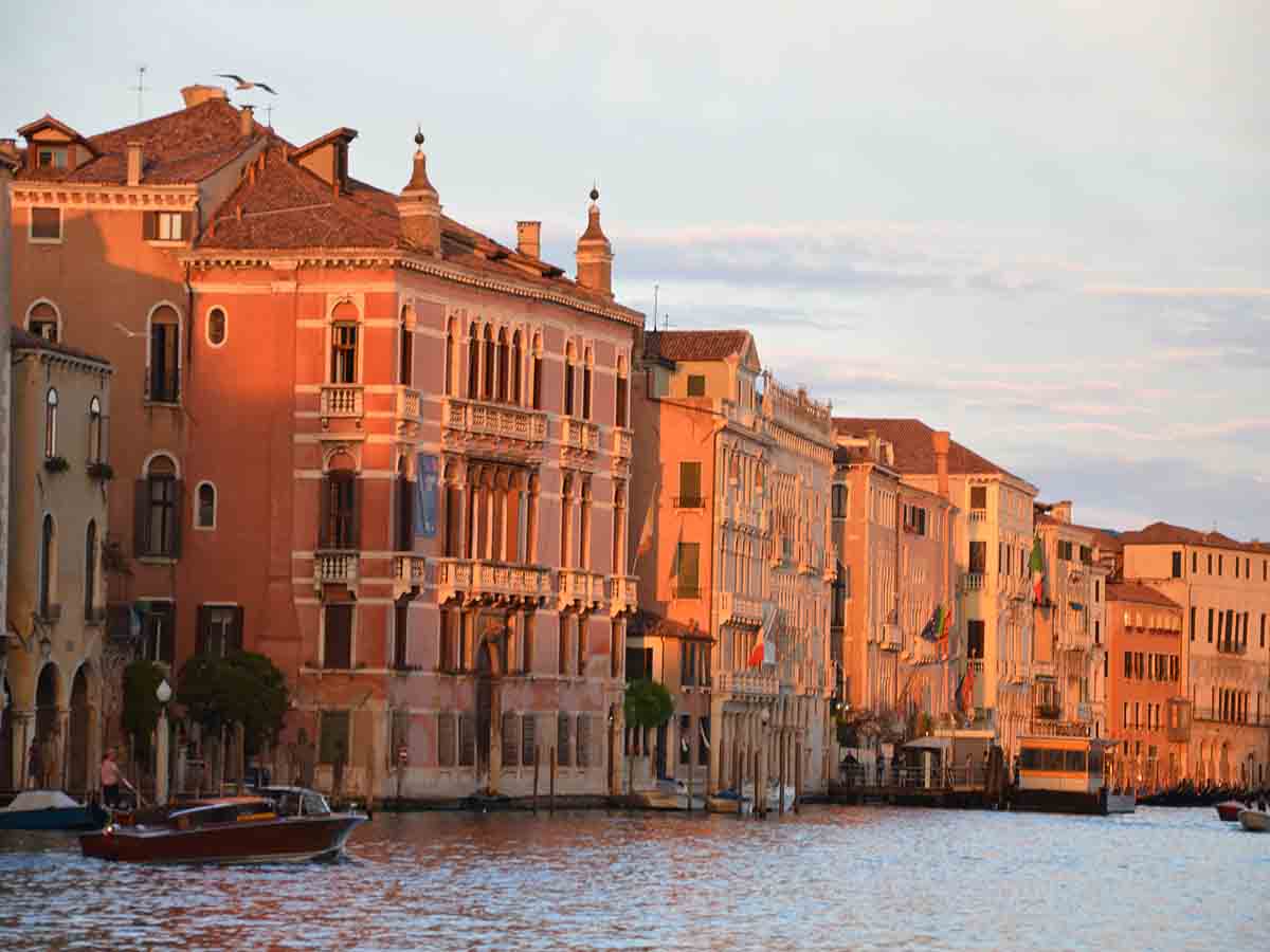 Venice buildings tinted rose in the setting sun